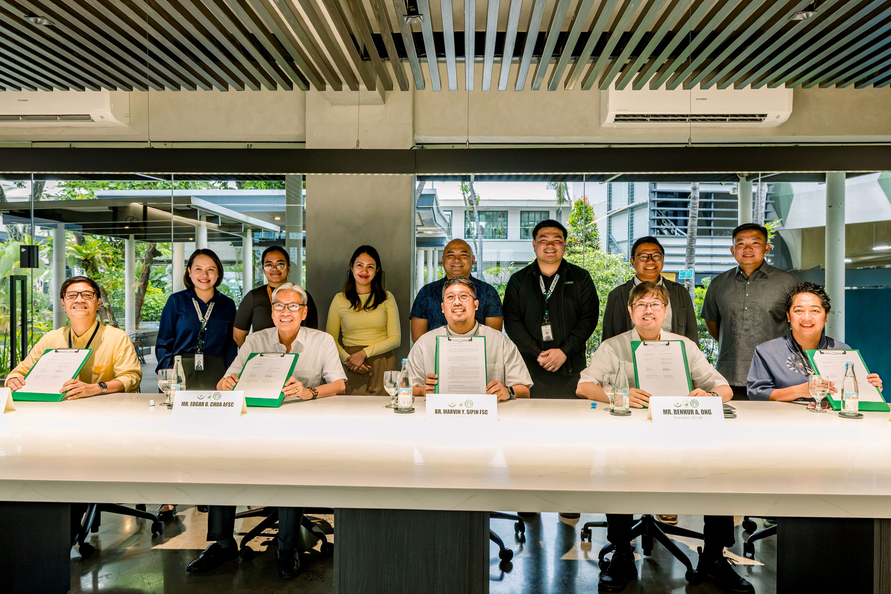 Benilde and DLSBI sign shared services MOA